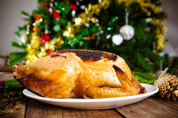 istock Grilled chicken, Christmas themed dinner on old wood table 494466536