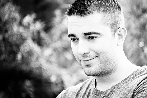 istock Handsome Young Man Smiling and Looking Away 494466758
