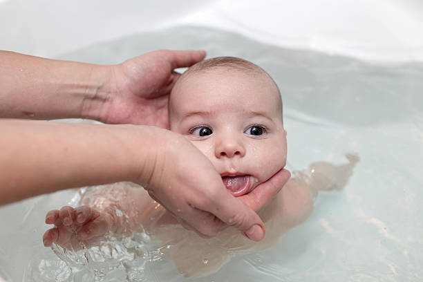istock Baby boy swimming in bath 494467066