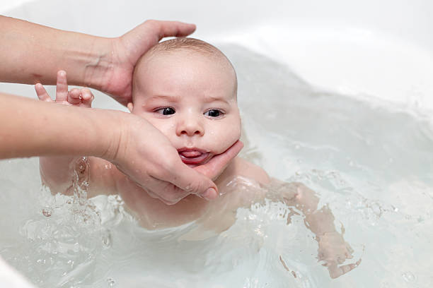 istock Baby swimming in bath 494467358