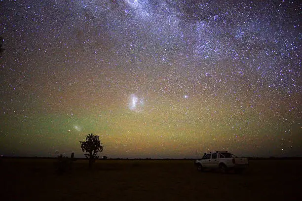 Solitude contemplating the stars in a lonely outback field.