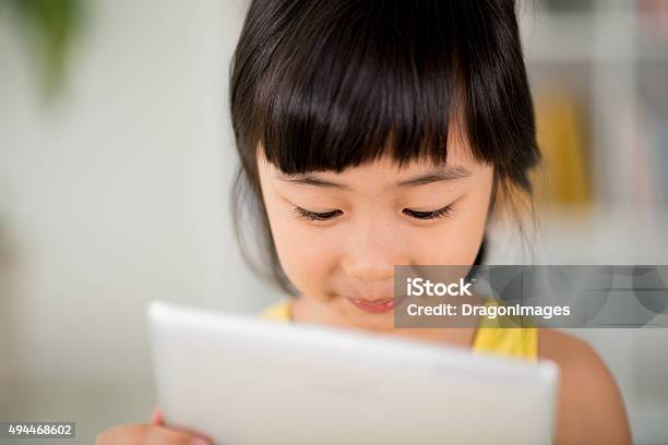 Girl With Digital Tablet Stock Photo - Download Image Now - 2015, Asian and Indian Ethnicities, Baby - Human Age