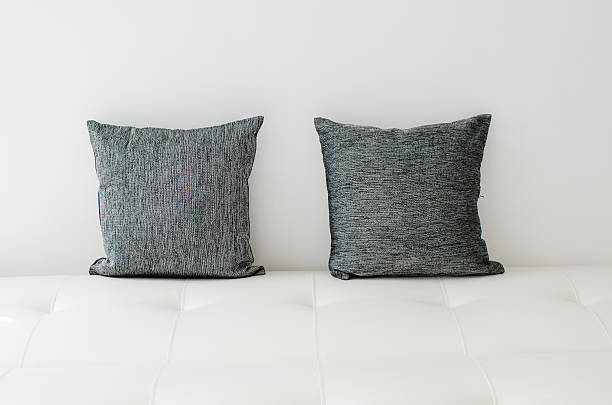 istock Black decorative pillows on a white casual sofa 494468956
