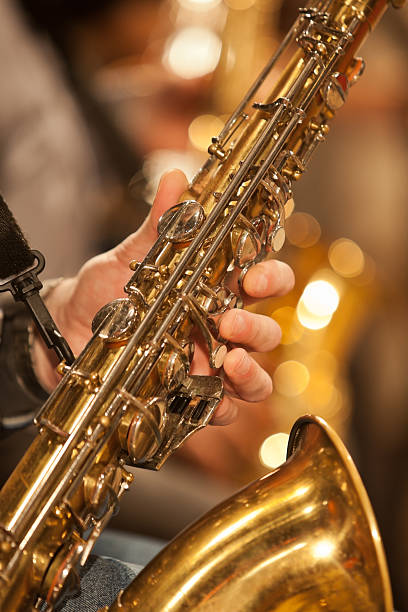 istock Hand of musician playing the saxophone 494472174