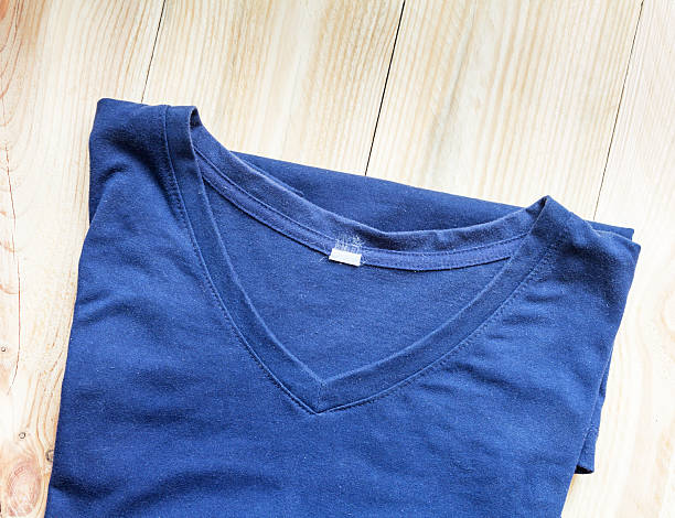 istock Blue men t-shirt on brown wood background 494472390