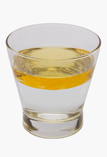 istock Oil floating on water surface in a glass 494472404