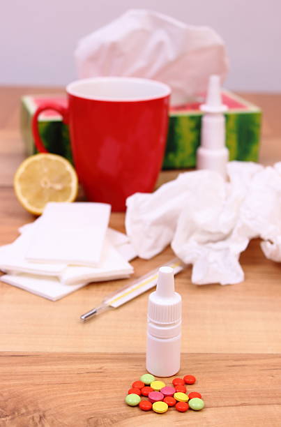 istock Pills and nose drops for colds, used handkerchiefs 494472586