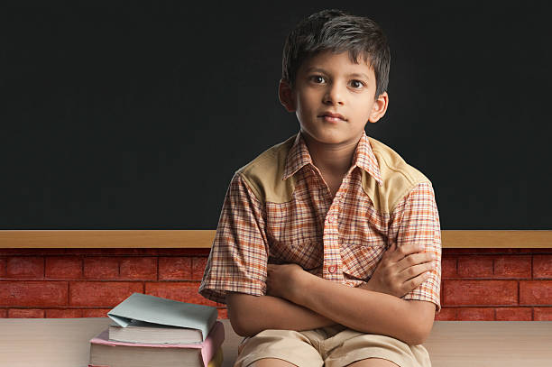 Boy imitating a teacher in a classroom