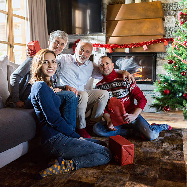 istock christams day: exchanging Christmas gifts at home 494473094