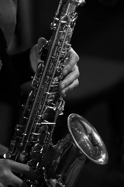 istock Hands girl playing the saxophone 494473210