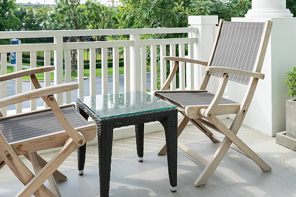 istock wooden chairs on modern balcony overlooking a garden 494473608