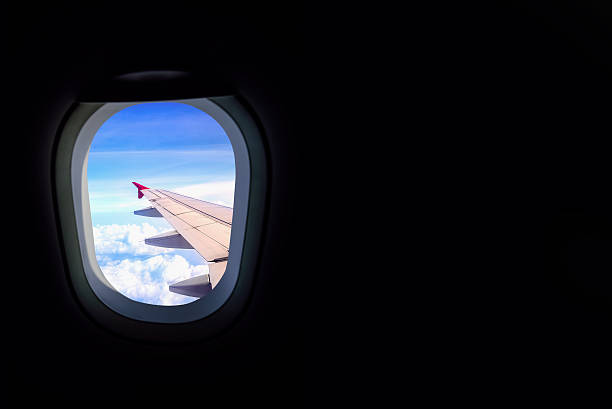 istock Window airplane Travel time is bright sky 494476672