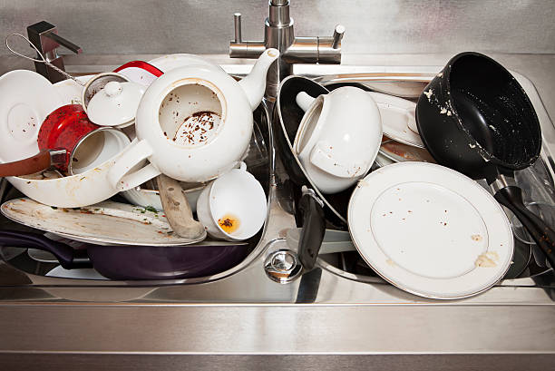 istock Dirty dishes on sink in the kitchen 494476810
