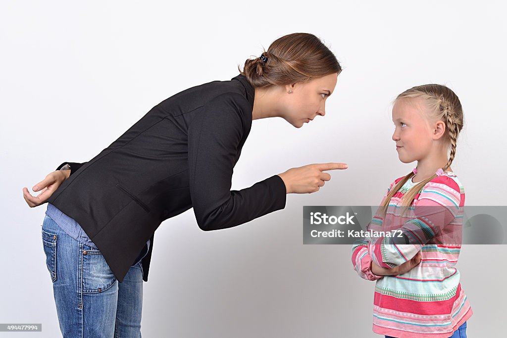 Mother and daughter having quarrel Anger mother and small daughter having quarrel  2015 Stock Photo