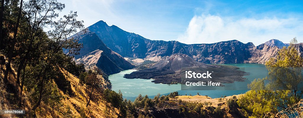 Queen of Lombok Mount Rinjani or Gunung Rinjani is an active volcano in Indonesia on the island of Lombok,  It rises to 3,726 metres (12,224 ft), making it the second highest volcano in Indonesia. Indonesia Stock Photo