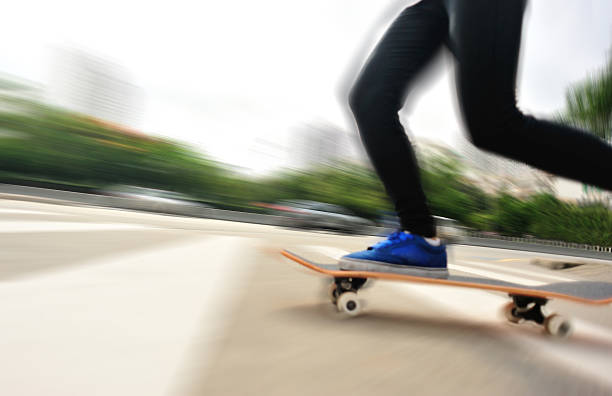 istock speeding skateboarding woman 494478635