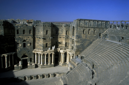 The ruins of the Roman Theatre in the city of Bosra in the south of Syria in the Middle East.
