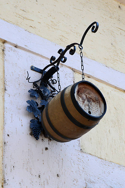 istock hanging wine barrel on ancient building 494479387