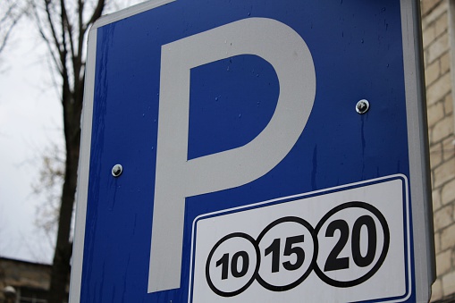 A close-up photo of Parking for money sign