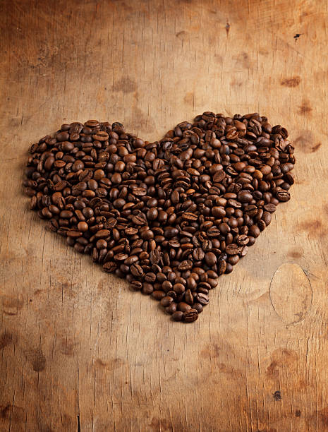 istock heart fron coffee beans, on wooden surface 494484259