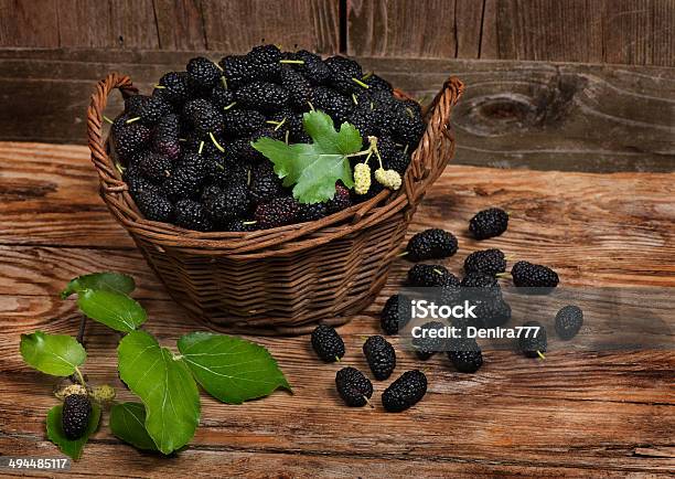 Mulberries With Leaves On A Wicker Basket Stock Photo - Download Image Now - Basket, Berry Fruit, Black Color