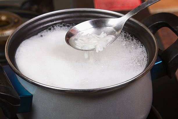 Close-up of a spatula over a pan of rice stock photo