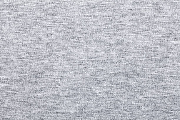 Melange jersey knit fabric pattern Real heather grey knitted fabric made of synthetic fibres textured background heather photos stock pictures, royalty-free photos & images