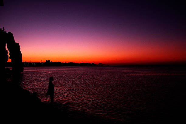 istock Sunrise and a lone female. 494499018