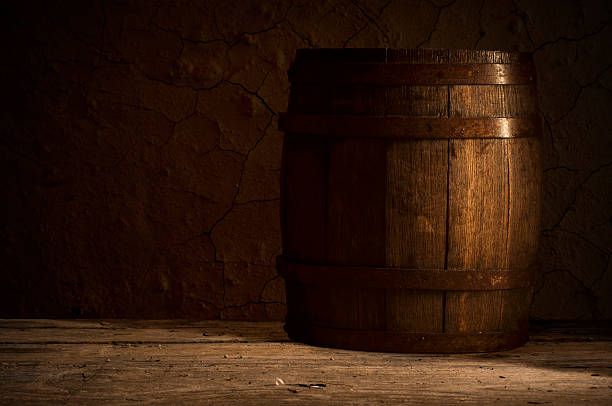 istock Old wooden barrel on a brown background 494499816