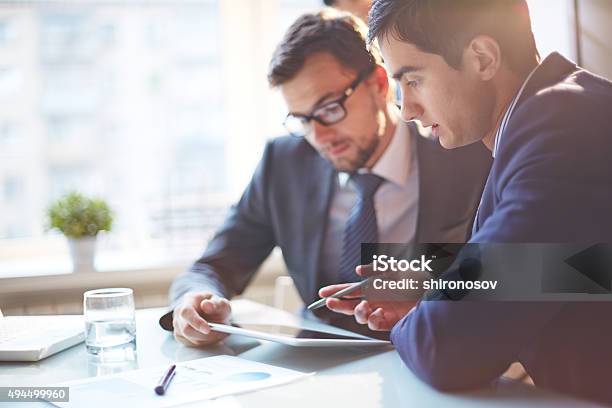 Looking At Data Stock Photo - Download Image Now - Business Meeting, Business Finance and Industry, Businessman