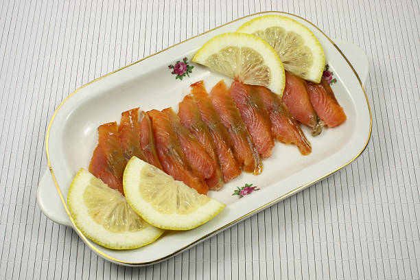 istock Slices of a smoked humpback salmon with a lemon 494500316