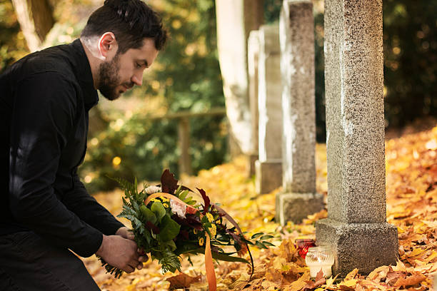 istock Man in the cemetery 494500390