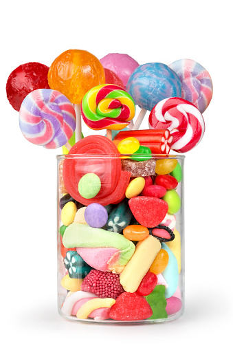 glass jar full of candy and lollipops