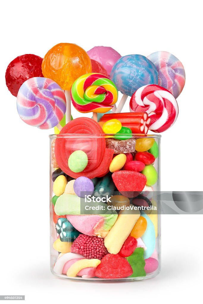 party mix sweets glass jar full of candy and lollipops Candy Stock Photo