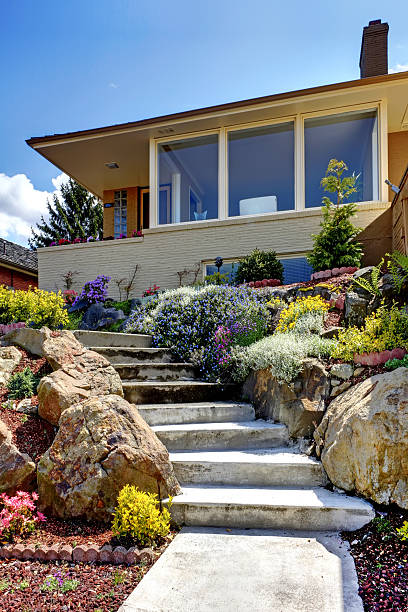 istock Modern house exterior with staircase and flowers. 494504843