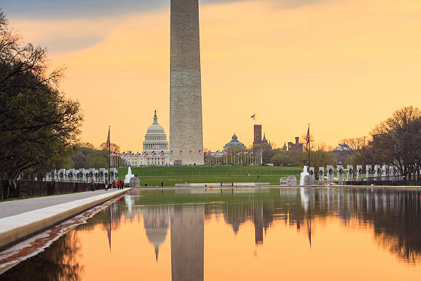 istock sunrise at dawn reflects Washington Monument 494505333
