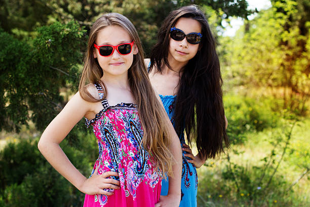 istock Two sisters laying down in the park 494506471