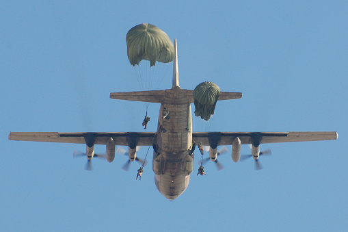Palmahim beach, Israel - August 11, 2009: Israeli paratroopers, Palmahim base opens its gates to the public for a free airshow every few years. This image shows paratrooper who were dropped from a  C130 airplane