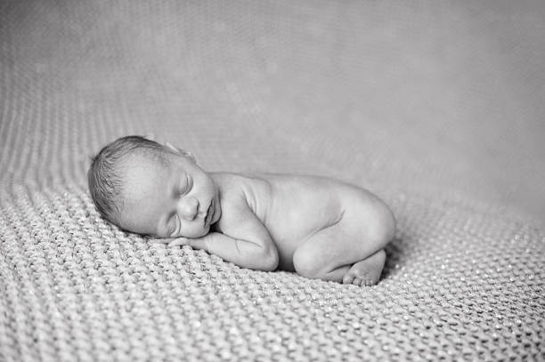 istock Preemie Sleeping Newborn Girl 494507149