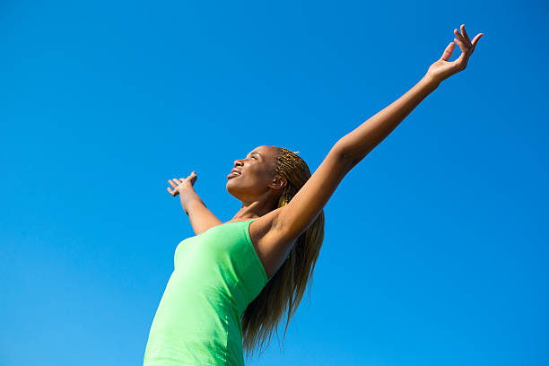 istock Woman With Her Arms Raised 494507537