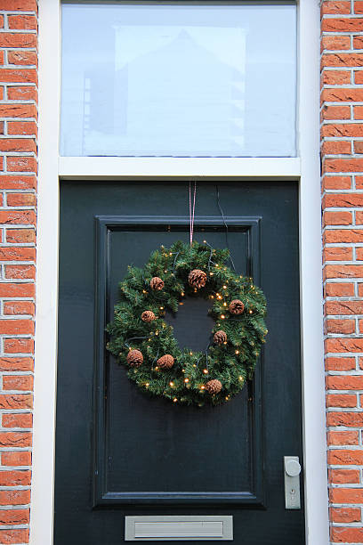 istock Classic christmas wreath with decorations on a door 494507746