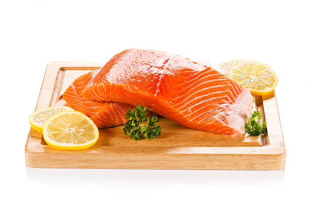 istock Fresh raw salmon fillet on cutting board 494507752