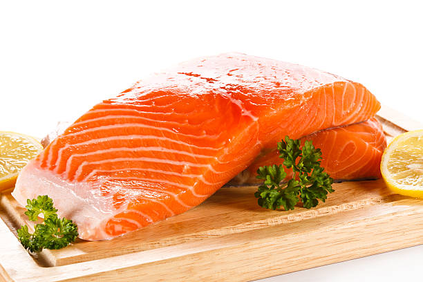 istock Fresh raw salmon fillet on cutting board 494507834