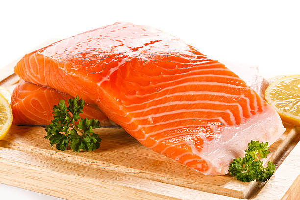 istock Fresh raw salmon fillet on cutting board 494507944
