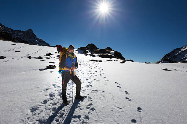 istock Backpacker mountaineer man standing rest snow mountain. 494508168