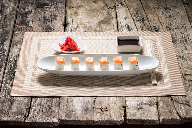 istock Seafood Sushi rolls in White Dish with soy sauce . 494509161