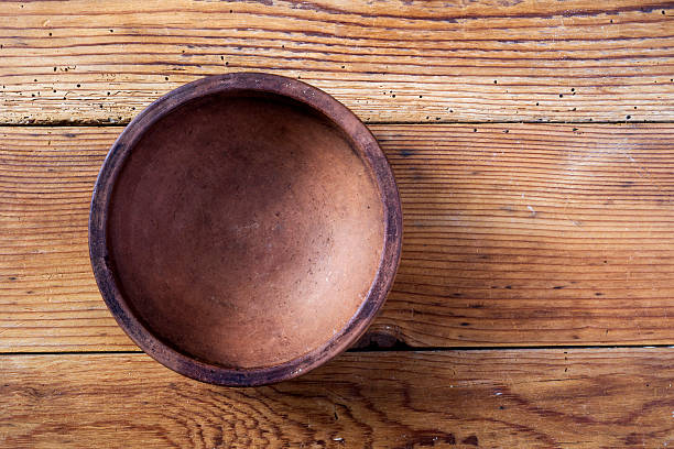 Ceramic bowl on wooden background stock photo