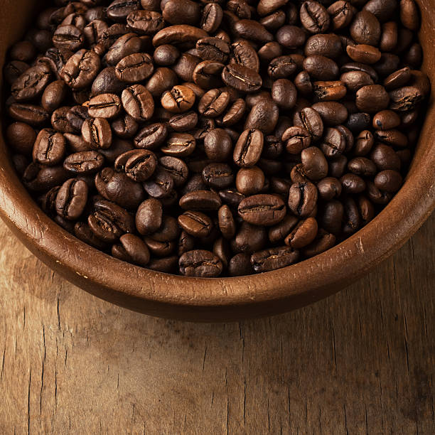 istock coffee beans on wood bowl 494510675