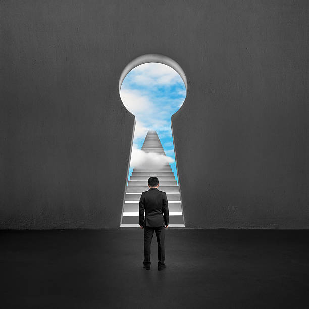 istock Facing key shape door with stairs and sky outside 494510943