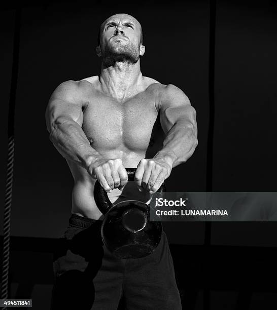 Gym Kettlebells Swing Exercise Man Workout Stock Photo - Download Image Now - 20-29 Years, Active Lifestyle, Activity